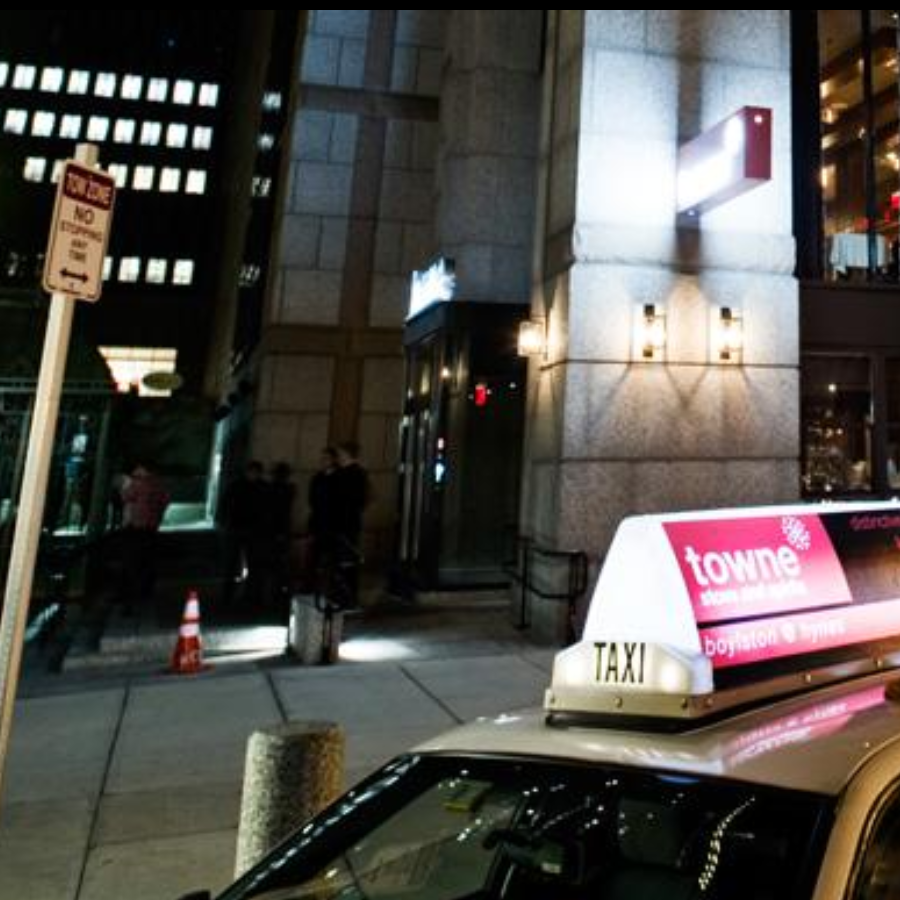 Street view with branded taxi ad